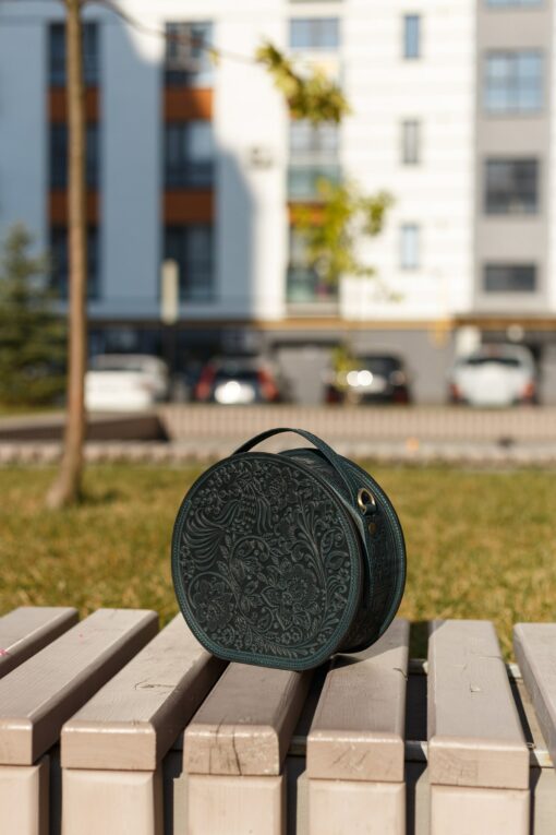 Exquisite Handmade Round Leather Bag with Intricate Flower Embossing - Image 6