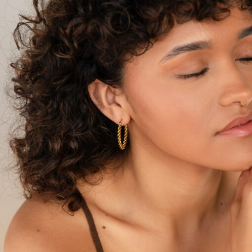 Bold and Twisted Elevate Your Style with Caitlyn's Minimalist Statement Hoops - Image 5