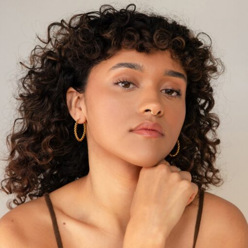 Bold and Twisted Elevate Your Style with Caitlyn's Minimalist Statement Hoops - Image 3