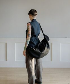 Spacious Black Hobo Bag with Green Lining and Adjustable Strap