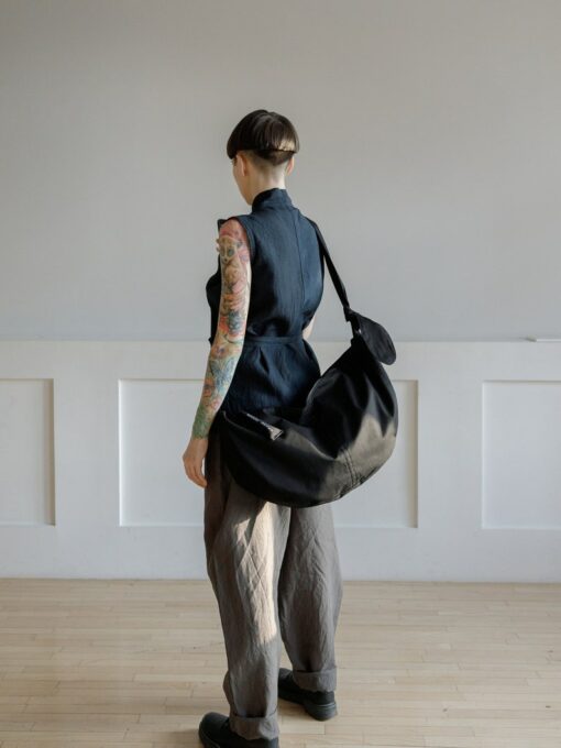 Spacious Black Hobo Bag with Green Lining and Adjustable Strap