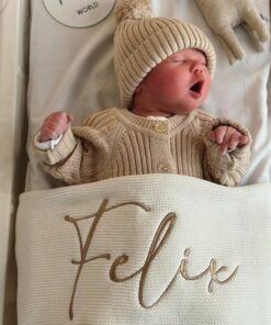 Cozy Comfort for Little Ones Off-White Knitted Baby Blanket with Embroidered Charm