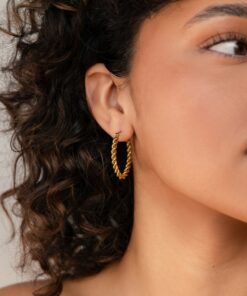 Bold and Twisted Elevate Your Style with Caitlyn's Minimalist Statement Hoops