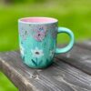 Enchanting Blue Guppy Daisies Pink Pixie Ceramic Mug A Delightful Gift for Tea and Coffee Aficionados