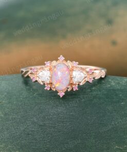Exquisite Oval Pink Opal Engagement Ring A Symphony of Rose Gold, Moissanite, and Pink Sapphire