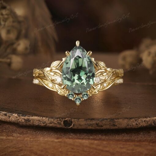 Nature's Embrace Vintage Pear Cut Green Sapphire Engagement Ring Set with Leaf-Inspired Wedding Band