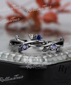 Nature's Embrace Blue Sapphire and Black Gold Twig Ring, a Symbol of Love and Growth