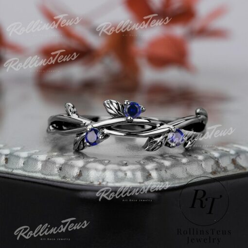 Nature's Embrace Blue Sapphire and Black Gold Twig Ring, a Symbol of Love and Growth